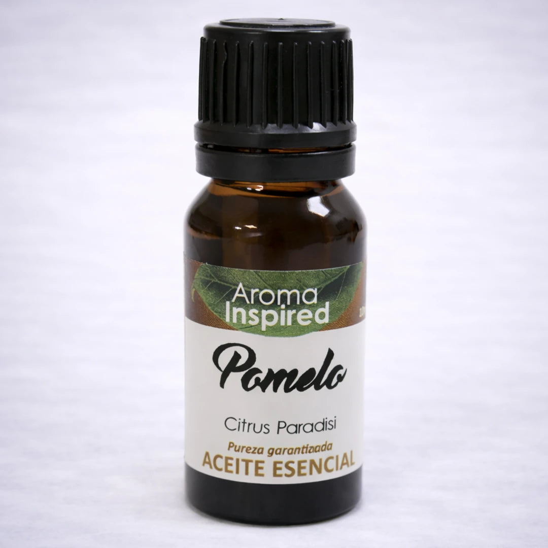 Aceite esencial de pomelo natural en frasco de vidrio ámbar, aroma cítrico revitalizante para bienestar y energía