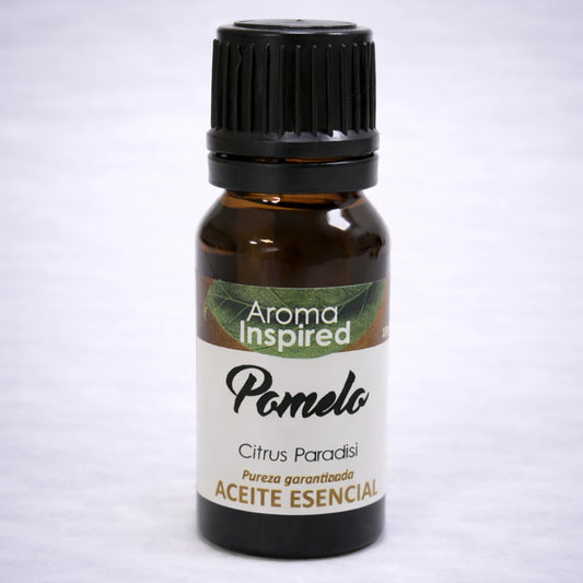 Aceite esencial de pomelo natural en frasco de vidrio ámbar, aroma cítrico revitalizante para bienestar y energía