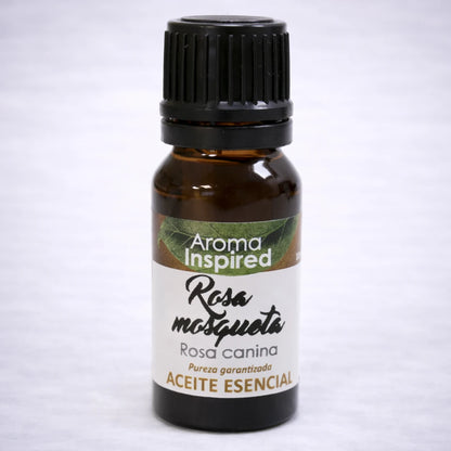 Aceite esencial de rosa mosqueta natural en frasco de vidrio ámbar, cuidado de la piel y bienestar aromático