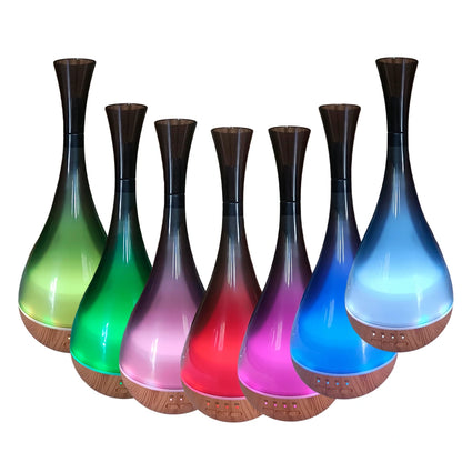 Difusor de Aromas Paris Esencia con luces LED de 7 colores encendidas, tecnología ultrasónica y diseño elegante tipo jarrón, ideal para aromaterapia y decoración moderna.
