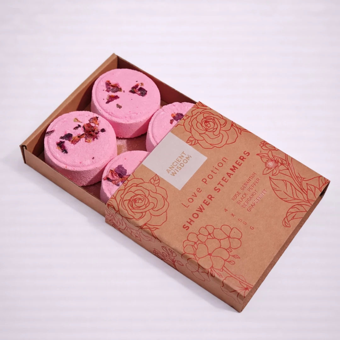 Vaporizadores de ducha Love Potion con aceites esenciales afrodisíacos en caja kraft abierta, experiencia aromática para la ducha