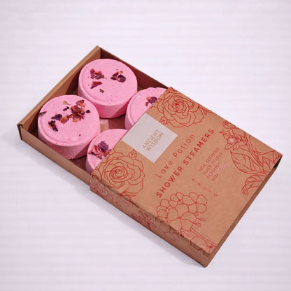 Vaporizadores de ducha Love Potion con aceites esenciales afrodisíacos en caja kraft abierta, experiencia aromática para la ducha