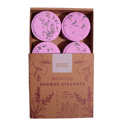 Caja de vaporizadores de ducha relajantes ZEN con aceites esenciales de lavanda, limón y salvia sclarea, presentada en envase ecológico de cartón con flores grabadas.