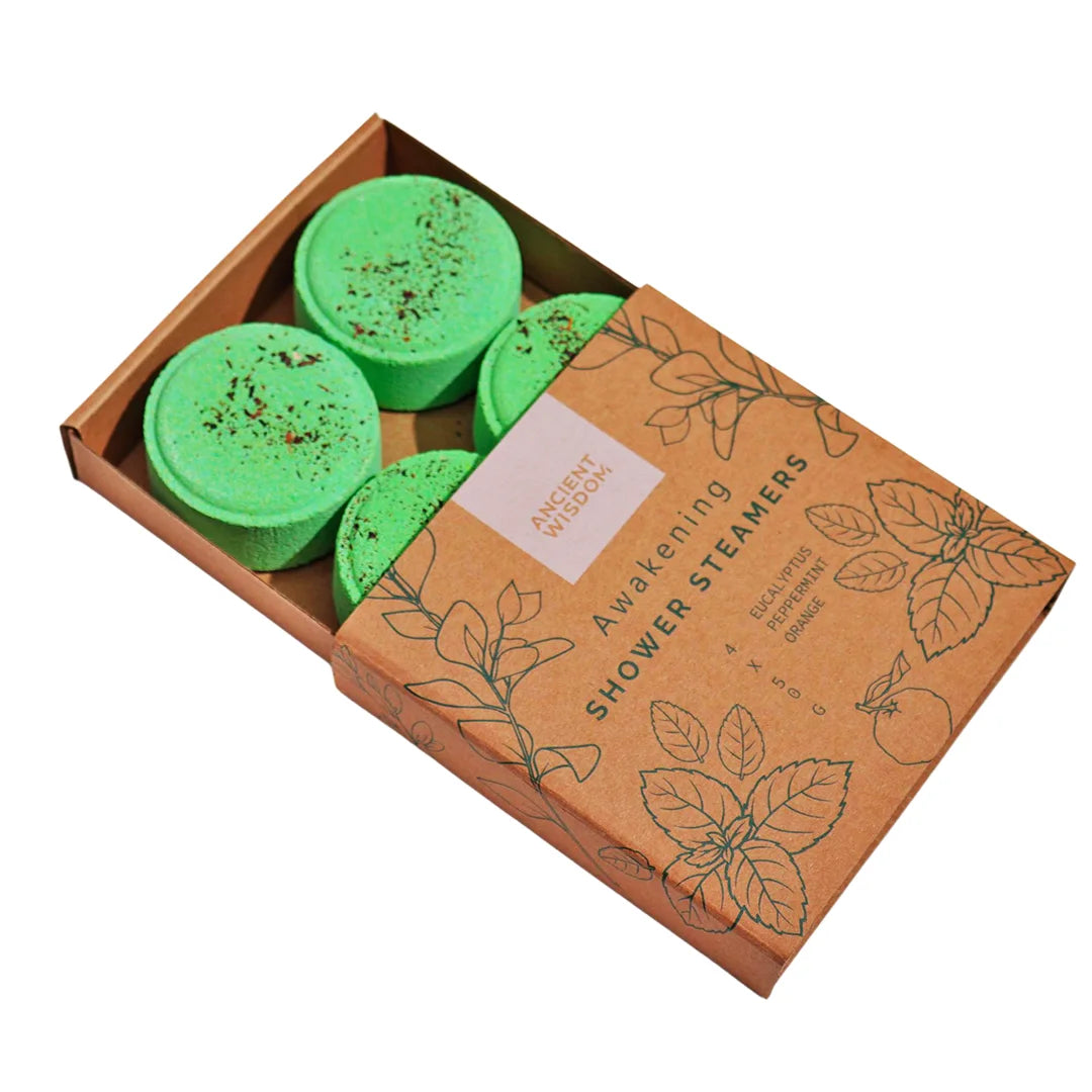 Vaporizadores de ducha Despertar con diseño natural y cuatro discos de color verde con semillas, ideales para revitalizar cuerpo y mente desde la ducha matutina.