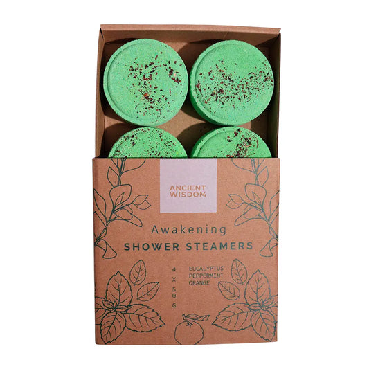 Caja de vaporizadores de ducha Despertar de Ancient Wisdom con cuatro discos verdes, elaborados con aceites esenciales de naranja, menta y eucalipto, presentados en envase kraft ecológico.